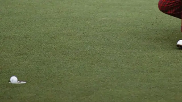 The ball enters the hole
