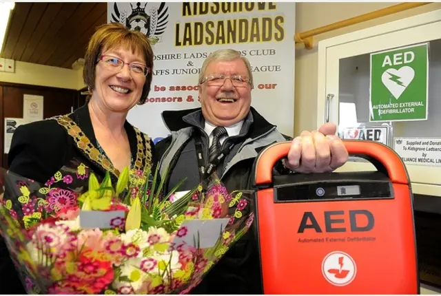 Kidsgrove Mayor Sylvia Dymond and League Welfare Officer Roland Hulse with the defibrillator.