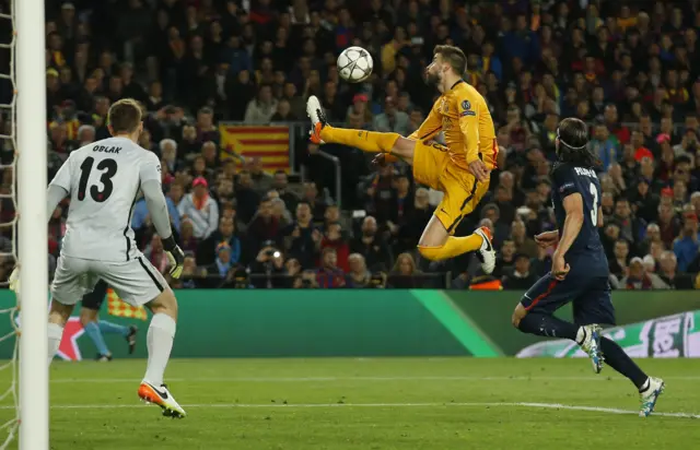 Gerard Pique controls the ball