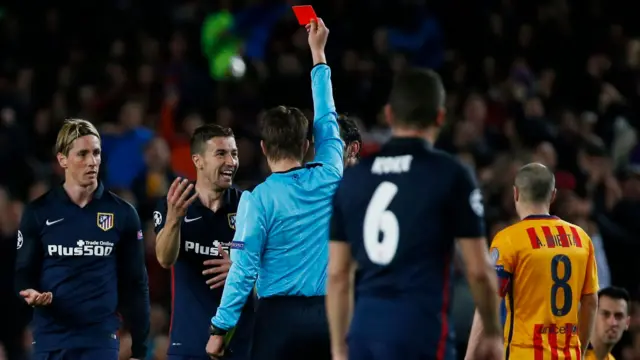 Fernando Torres is shown a red card