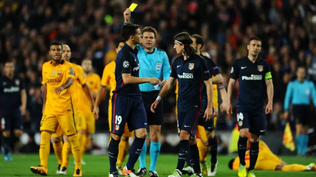 Felix Brych shows a yellow card