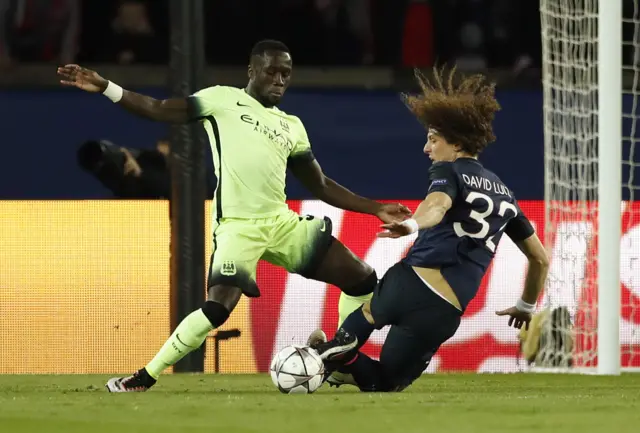 Bacary Sagna fouls PSG's David Luiz