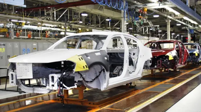 A car is manufactured on the assembly line at the Sterling Heights Assembly Plant