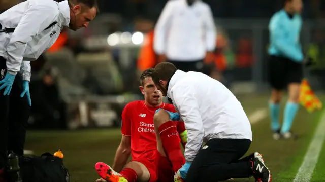 Jordan Henderson receives treatment