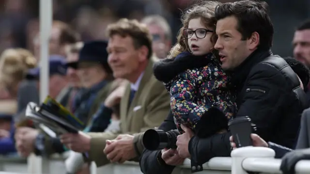 Fans watch at the 2015 Grand National meeting