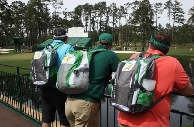 Three men wear Masters back packs