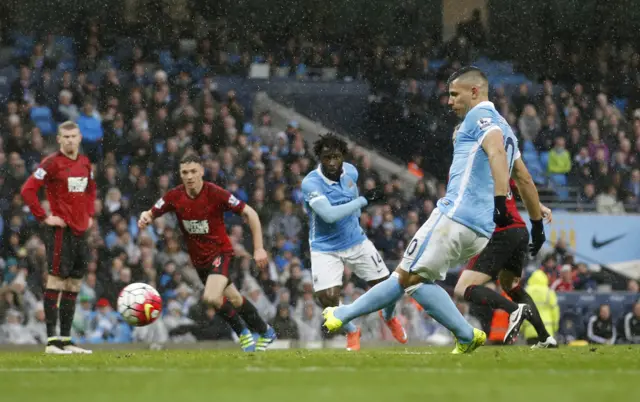 Sergio Aguero scores the first goal for Manchester City from the penalty spot