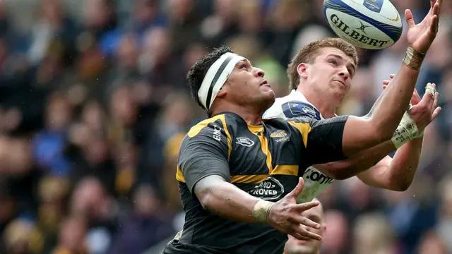 Nathan Hughes and Henry Slade challenge for the ball