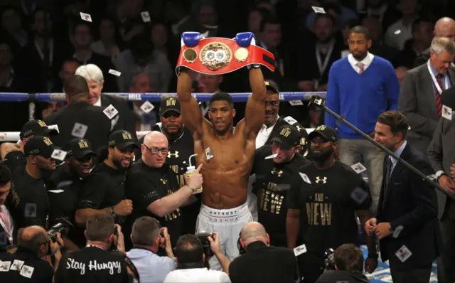 Anthony Joshua celebrates with team