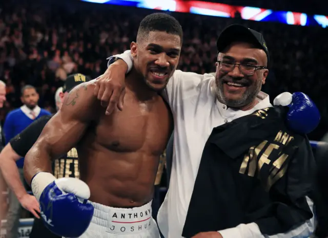 Anthony Joshua celebrates with his dad