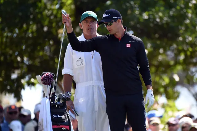 Adam Scott and his caddy on course