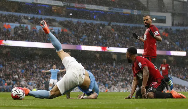 Manchester City"s Aleksandar Kolarov is brought down by West Brom"s Stephane Sessegnon in the are resulting in a penalty to Manchester City