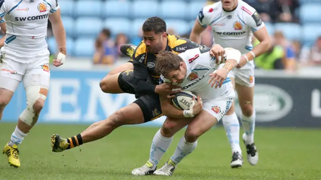 Wasps' Frank Halai tackles Exeter's Ben Moon