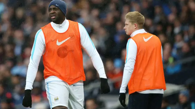 Yaya Toure and Kevin de Bruyne warm up