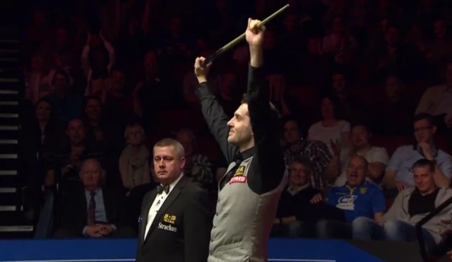 Mark Selby celebrates winning the final frame