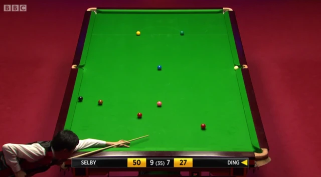 Ding pots the white ball