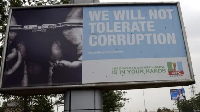 APC party billboard reads "We will not tolerate corruption"