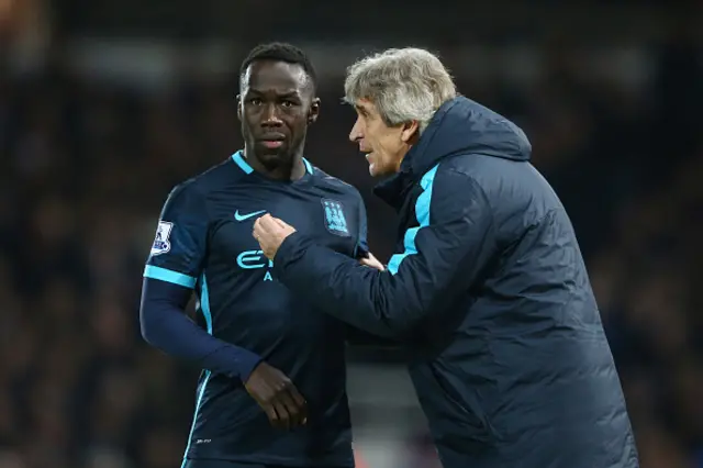 Manchester City manager Manuel Pellegrini (right) and defender Bacary Sagna