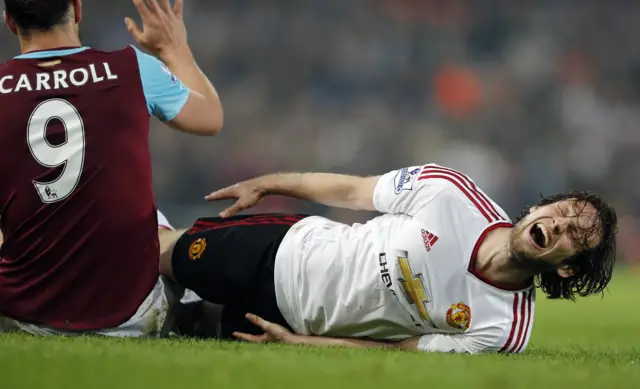 Andy Carroll challenges Daley Blind