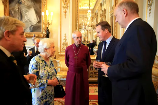 Queen Elizabeth II speaks with Prime Minister David Cameron