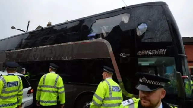 Manchester United's damaged team coach before the match