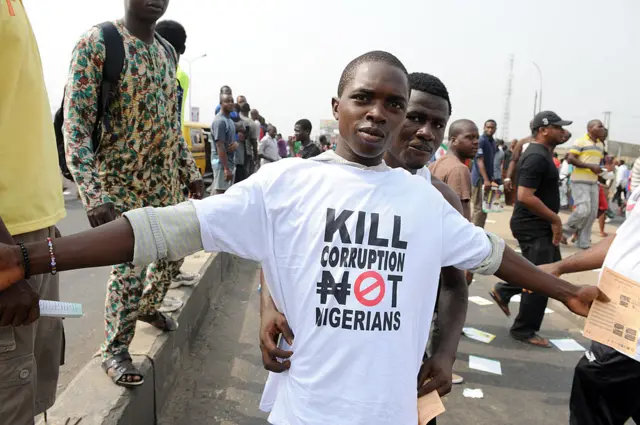 protester sports a an anti-corruption T-shirt on January 9, 2012 in Lagos