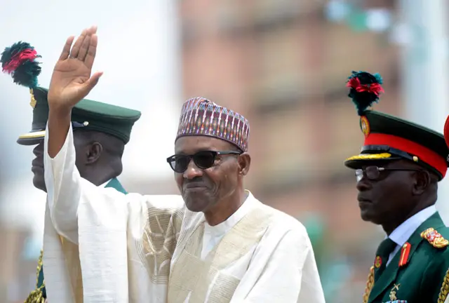 Nigeria's new President Mohammadu Buhari waves to the crowd during his inauguration at the Eagles Square in Abuja, on May 29, 2015.