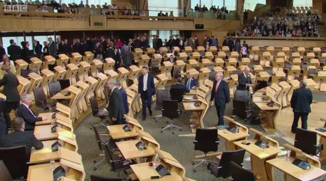 MSPs collecting ballot papers