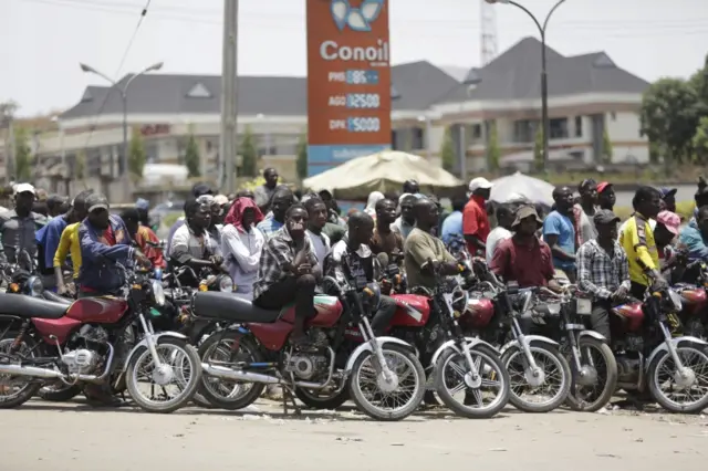 Motorbike queuing for fuel in Nigeria