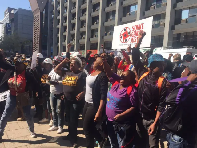 Cheering people outside South Africa's High Court in Johannesburg - Friday 13 May 2016