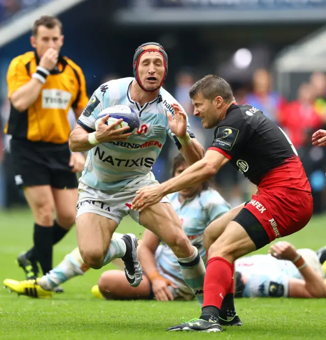 Johannes Goosen of Racing 92 is tackled by Richard Wigglesworth