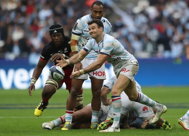 Mike Phillips of Racing 92 passes the ball