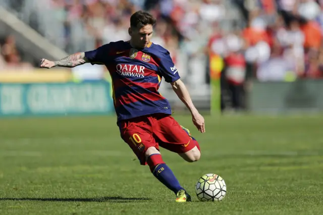 Lionel Messi takes a free kick