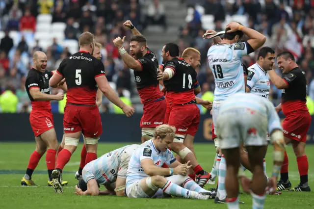 Saracens players celebrate victory