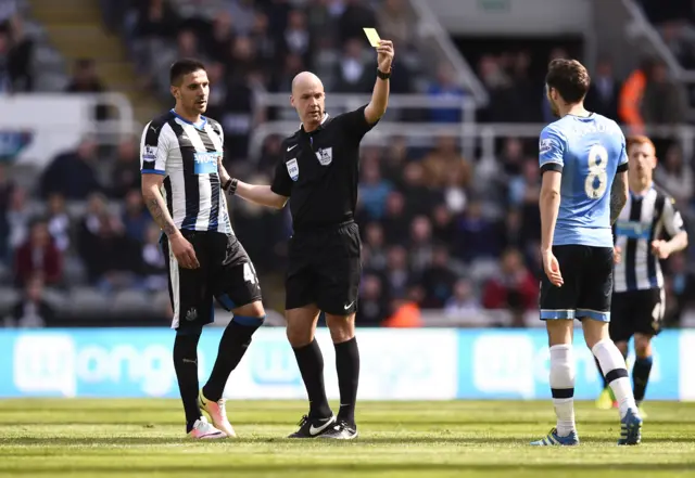 Ryan Mason is shown a yellow card