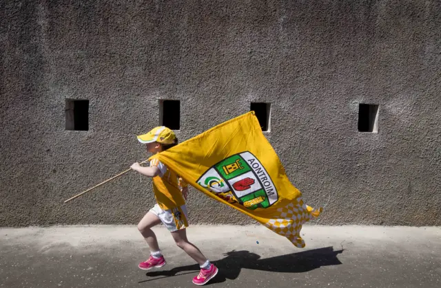 Belfast girl Aoibh Woods skips along to Brewster Park, with the seven-year-old proudly displaying her county colours