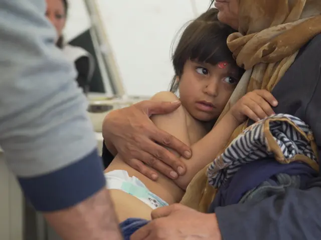 A child in Idomeni on the Greek-Macedonian border