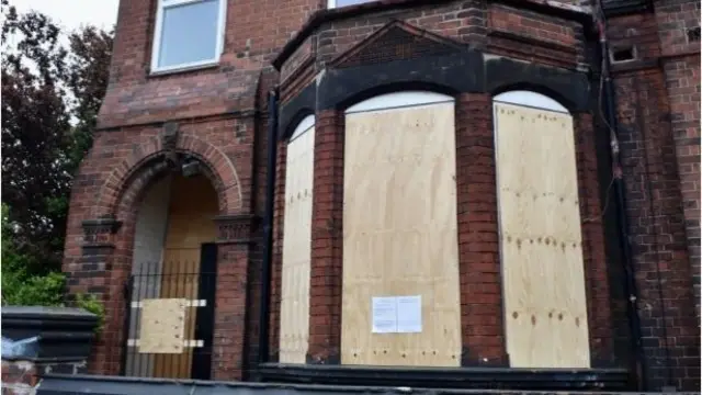 The house which is now boarded up