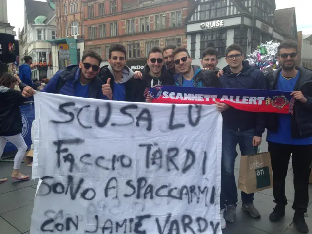 Italian fans with a banner