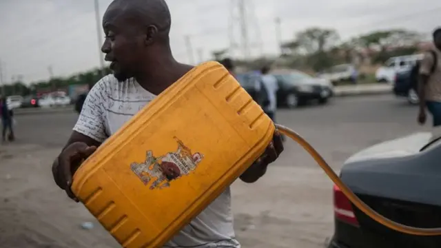 Filling car with fuel in Lagos, Nigeria. 10 April 2016