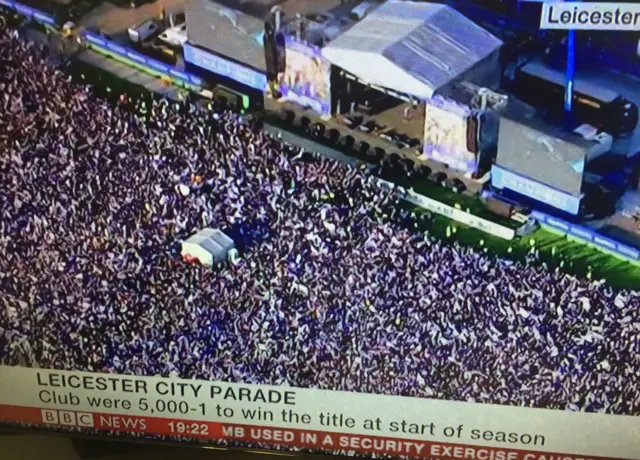 TV screen showing crowds at Victoria Park