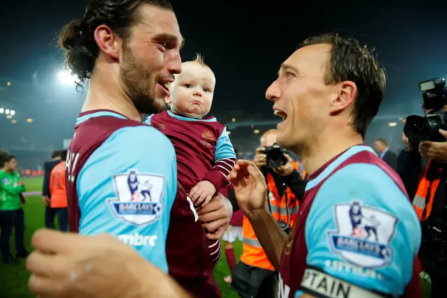 West Ham's Andy Carroll, his baby son and club captain Mark Noble