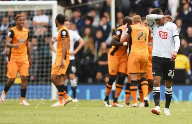 Hull players celebrate scoring in their Championship play-off semi-final away to Derby