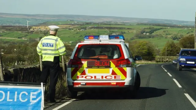 Policeman on country road