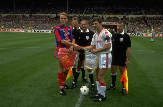 Palace captain Geoff Thomas (left) and Man Utd's skipper Bryan Robson