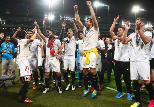 Sevilla party on the pitch