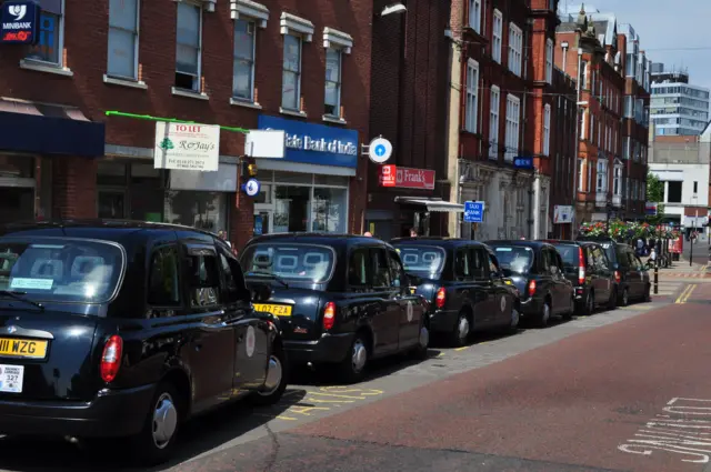 Taxis parking in rank