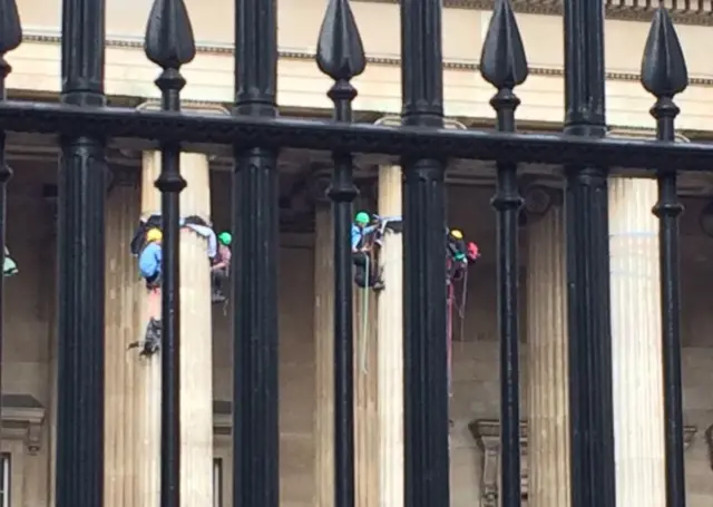 Protesters climbing British Museum columns