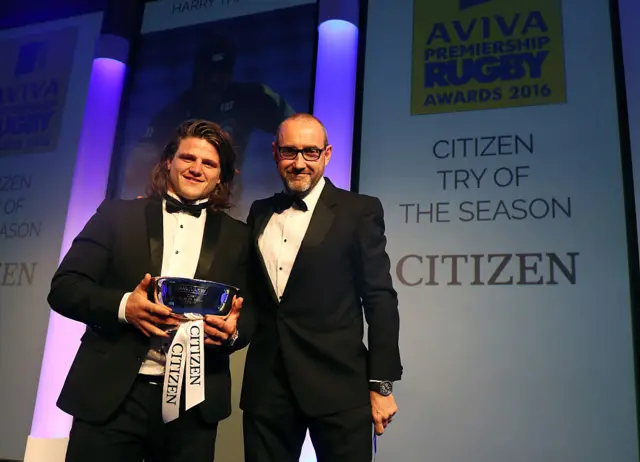 Harry Thacker holding his award