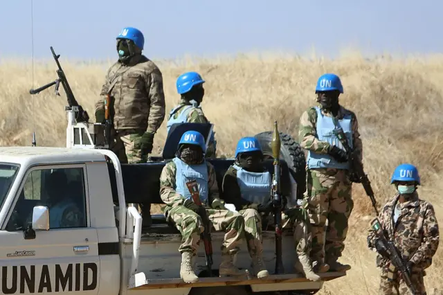 Members of the UN-African Union mission in Darfur (UNAMID) patrol the area near the city of Nyala in Sudan's Darfur on January 12, 2015